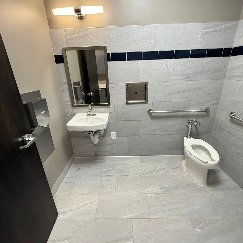New restroom with sink and toilet cleaned and disinfected