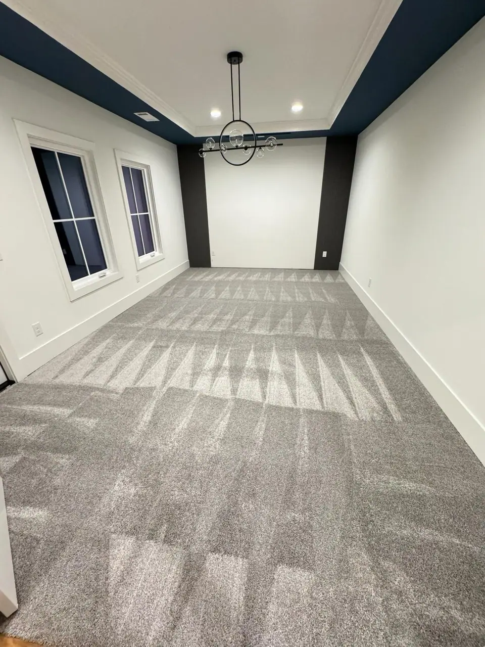 Empty room with freshly vacuumed carpet ready for move-in