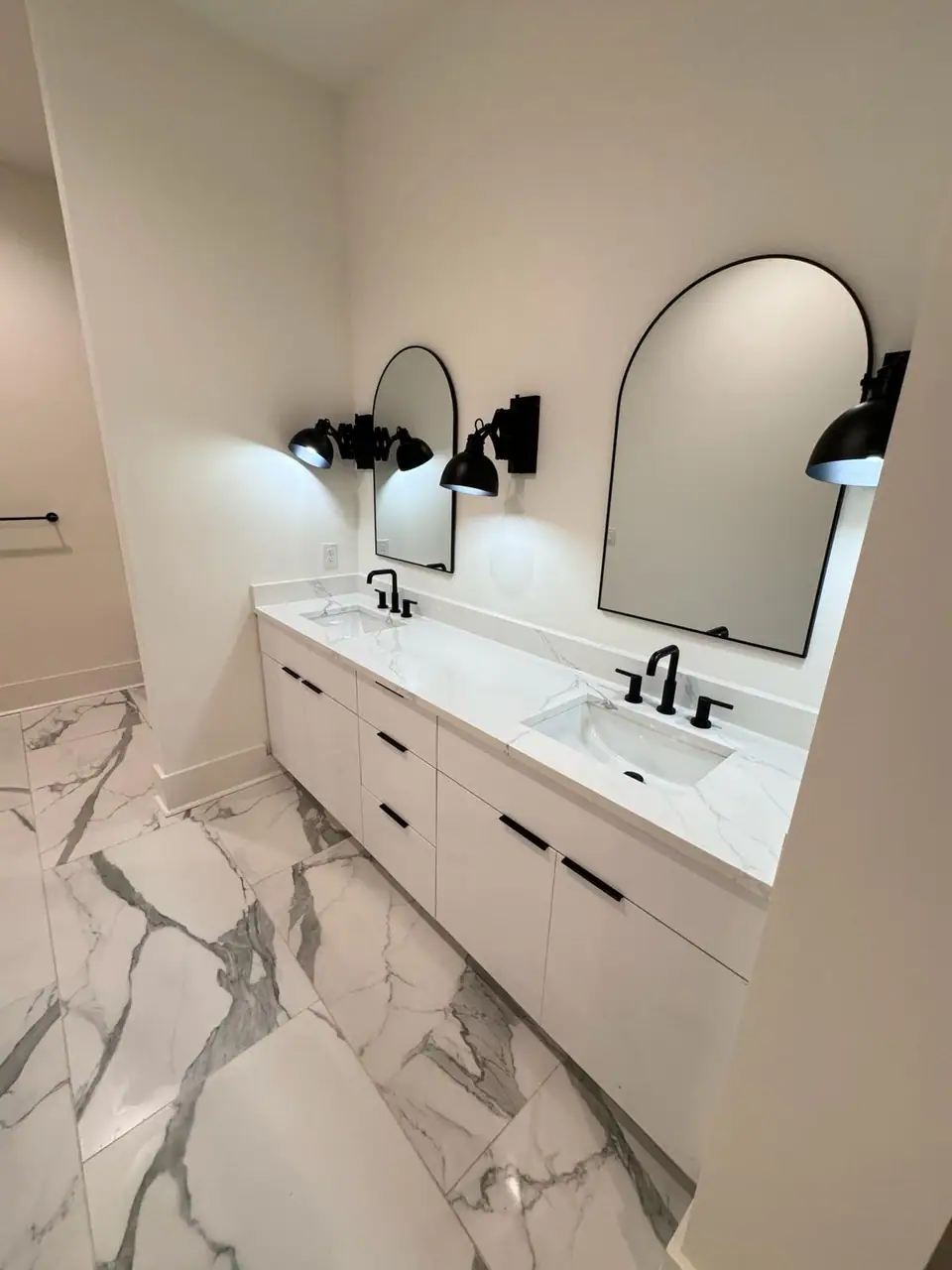 Spotless bathroom double vanity and mirrors after a deep clean